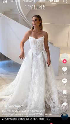 a woman in a white wedding dress standing next to a stair case with the caption's name on it