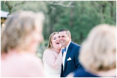 a bride and groom laughing at each other