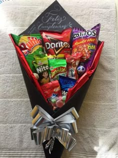 the candy bouquet is wrapped in black paper