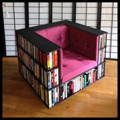 a chair made out of books is sitting on the floor