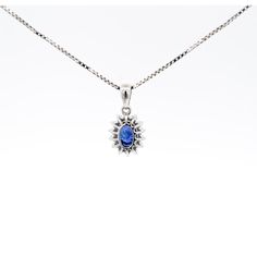 Item Details: - Type: Drop Pendant Necklace  - Metal: 18K White Gold  - Weight: 1.05 Grams (pendant only) - Setting: Prong, Halo ______________________________  Center Stone Details: - Type: Natural Sapphire  - Carat: 1.20  - Cut: Oval  - Color: Blue  - Measurements: 6.5 X 5 MM  ______________________________  Side Stone Details:  - Type: Natural Diamond  - Cut: Round  - Color: G-H - Clarity: SI1-SI2 - Quantity: 14  ______________________________  Dazzling modern drop pendant necklace, featuring a 1.20 carat natural oval cut Sapphire radiating a deep royal blue. This center stone is matched with 14 piece round-cut diamond halo in a star motif pendant made of 18K white gold. Set with an open back to allow for the center stone's natural color to be on full display.   The default order comes Oval Sapphire Necklace With Brilliant Cut, Sapphire Necklace With Oval Halo Setting, Oval Sapphire Necklace With Halo Setting, Oval Blue Diamond Necklaces, Blue Oval Diamond Necklaces, Oval Blue Diamond Cut Necklace, Sapphire Oval Necklace With Diamond Cut, Oval Sapphire Necklace With Diamond Cut, Blue Oval Diamond Cut Necklace