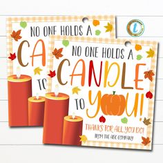 two cards with the words, no one holds a candle to you and an orange pumpkin