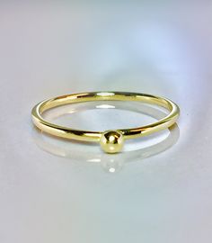 Cute and Dainty solid gold droplet ring Great for baby/children and adults fingers Very sparkly Pave diamond cut or smooth polished finish. **Gold: 14k/10k Real Solid Gold **Thickness approx : 1.0mm **Droplet size: 2.0mm Sturdy and well designed and great for any occasion. **Order yours Today! Gold Stackable Teardrop Jewelry, Yellow Gold Stackable Teardrop Jewelry, Yellow Gold Teardrop Stackable Jewelry, Dainty Teardrop Gold Ring, Adjustable Yellow Gold Teardrop Rings, Adjustable Teardrop Yellow Gold Ring, Minimalist 14k Gold Teardrop Ring, Hypoallergenic Yellow Gold Stackable Rings, Hypoallergenic Yellow Gold Toe Ring