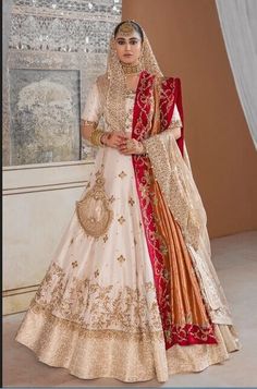 a woman in a white and red bridal gown