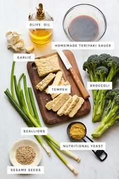 broccoli, celery, sesame seeds and other ingredients on a cutting board