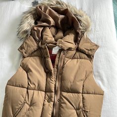 Size 8 Tan Vest From H & M. The Faux Fur Hood Is Removable. Never Worn. H&m Fitted Winter Outerwear, H&m Outerwear For Cold Weather And Winter, H&m Winter Outerwear For Cold Weather, Fitted H&m Outerwear With Pockets, Tan Vest, Winter Vest, H&m Jackets, Fur Hood, Faux Fur