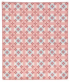 a pink and blue quilt with squares on it