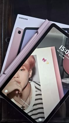 the samsung galaxy note 10 is on display with its pink case and matching accessories next to it