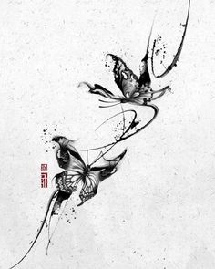 two butterflies flying next to each other on a white surface with chinese writing in the background