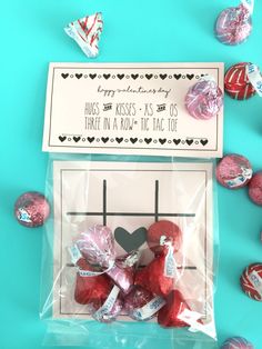 valentine's day treat bag with herss kisses in it and candy on the side