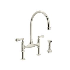 a kitchen faucet with two handles and nozzles