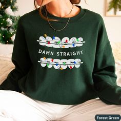 Looking for an ugly Christmas sweater gift for your dentistry office team or dentist?   Have a giggle this Christmas at your orthodontist office or dental office with the Christmas version of our popular Damn Straight orthodontics shirt. These are perfect for any dental office staff, dental assistant, dental school student, or dentist/orthodontist to wear to work.  Plus, they make great staff appreciation gifts for your new dental school graduate or whole Orthodontic dentistry team, and make a l Dental Christmas Shirts, Ortho Assistant, Orthodontist Office, Office Xmas Party, Dentist Christmas, Dental Christmas, Christmas Gift Her, Dentistry Office, Staff Appreciation Gifts