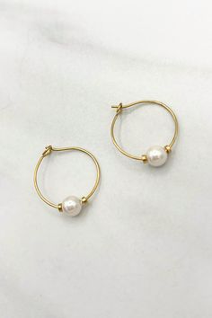 Elevate your everyday wear with our Simple Dainty Single Pearl Bead Hoops. These elegant hoops feature a single pearl bead, adding a touch of sophistication to any outfit. With a minimalist design and high-quality materials, these hoops are perfect for any occasion. Details:- 2 Small Accent Beads- Genuine Freshwater Pearl- Handmade at JFY- Hook Hoop Attachment Dimensions:- Hoop Diameter: 0.75"- Pearl Size: 6mm Single Pearl, Fresh Water Pearl, Beaded Hoops, Freshwater Pearl Necklaces, Pearl Size, Body Oil, Pearl Beads, Fresh Water, Freshwater Pearls