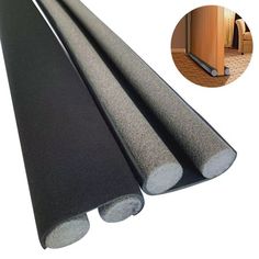 an image of a black mat with the door open and two pieces of carpet on it