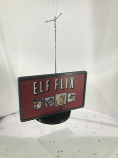 a sign hanging from the ceiling that says elff fix on it's side