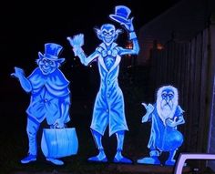 three animated figures are lit up in the dark