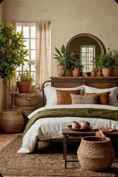 a bedroom with potted plants on the wall and a bed in front of it