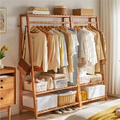 an organized closet with clothes and baskets