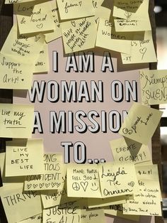 post - it notes are pinned to the wall with words written on them that read, i am a woman on a mission to