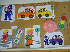 children's artwork displayed on brown paper with pictures of people and vehicles in the background