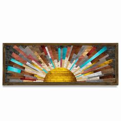 a wooden wall hanging with an image of the sun in it's center and multicolored stripes