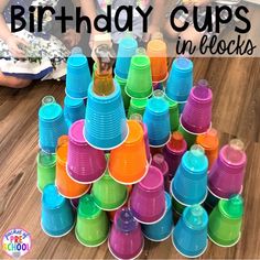 birthday cups stacked on top of each other with the words happy birthday cups in front of them