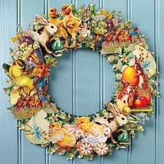 a wreath is hanging on the front door with many different animals and flowers around it