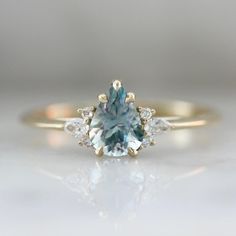 Borealis Light Blue Pear Cut Montana Sapphire Cluster Ring - Gem Breakfast Asymmetrical Engagement Ring, Gem Breakfast, Sapphire Cluster Ring, Montana Sapphire Engagement, Montana Sapphire Engagement Ring, Stackable Engagement Ring, Montana Sapphire Ring, Blue Gemstone Rings, Traditional Engagement Rings