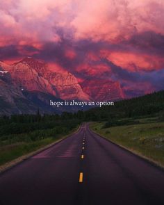 an empty road with the words hope is always an option in front of a mountain range