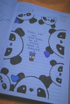 an open notebook with panda faces on it