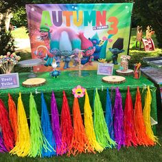 the table is decorated with colorful tassels and decorations