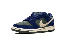 The Nike SB Dunk Low "Deep Royal Blue" is a colorway of the retro skateboarding shoe with a unique arrangement of colors and materials.  Perfect for skating or casual wear, the SB Dunk continues to be among the most popular shoes in the game.  The upper features a Vintage Green suede base and Deep Royal Blue suede overlays.  A Sail leather Swoosh is seen on both sides of the shoe, while white “Nike” branding is embroidered on the navy suede heel tab.  A “Nike SB Dunk” logo can be found on the to