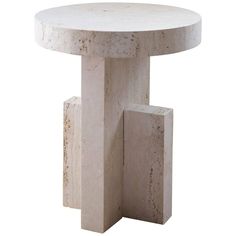 a white marble table with two blocks on the bottom and one block in the middle