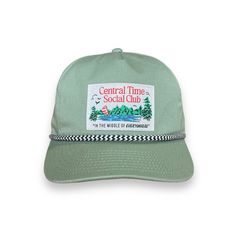 The Lake Souvenir Hat is for all the Central Time Social Clubbers out there! It is made for all day wear and a comfortable fit so you can chill in style. This club is inspired by good times and good people. Central Timers are the heart of it all - and that's our sweet spot - "in the middle of everywhere." With a little nostalgia and a lot of fun, Central Time Social Club is simply a state of mind. It's a feeling, and if you know the feeling - then you're already in the club. For more on the stor Fun Streetwear Hats With Short Brim, Fun Short Brim Hats For Streetwear, Vintage Cotton Snapback Hat With Short Brim, Fun Cotton Hats For Streetwear, Green Vintage Snapback Hat For Summer, Vintage Green Snapback Hat For Summer, Retro Cotton Trucker Hat With Curved Brim, Casual Green 5-panel Trucker Hat, Fun 5-panel Streetwear Hats