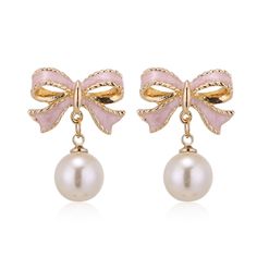 PRICES MAY VARY. Bow Pearl Earrings --- These pearl earrings with a dangling bow are the perfect accessory for any outfit, adding a touch of trendy and unique.It is perfect for date earrings party earring wedding earrings.Fashion and eye-catching design will certainly bring a lot of attention and help you win more praise. Size --- As shown in the figure,Due to manual measurement, there is an error of 1-2cm. Material --- Made of alloy, it is easy and comfortable to wear. Gift --- These gold and s Bride Earrings, Daily Jewelry, Wedding Party Jewelry, Rhinestone Bow, Bow Earrings, Christmas Gift Jewelry, Dream Jewelry, Pearl Drop Earrings, Elegant Earrings