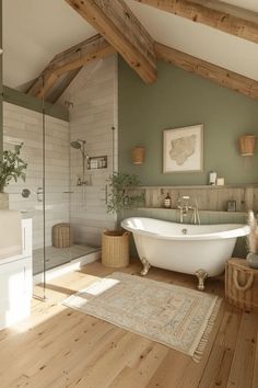 a bathroom with wooden floors and green walls