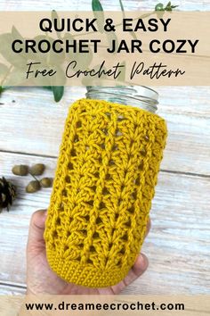 a hand holding a mason jar with the text quick and easy crochet jar cozy