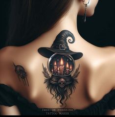 the back of a woman's neck is decorated with tattoos, candles and witches