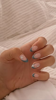 Blue French tip almond nails with diamanté's and silver stars on both thumbs and both ring fingers. Almond Nail Inspo Stars, Gel X Almond, Short Almost Nails, French Tip Star Nails Y2k, Blue Star French Tip Nails, Almond Gel X Nail Designs, Cool Almond Nails, Blue With Stars Nails, Star Nails Acrylic Y2k Almond