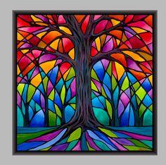 a painting of a tree with colorful stained glass in the center and bottom part of it