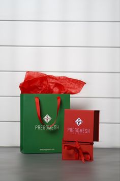 two red and green bags sitting next to each other