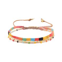 Colorful, fun and very stackable. We love these bracelets because they are perfect for an active lifestyle, low maintenence and easy to take off and on. Adjustable size that fits most wrists Japanese glass beads, round glass bead polyester thread, gold plated chain, gold plated Mishky logo Beaded area Width 0.3" / Length 5.1" "Mishky trains and employs women from predominately low income communities. Many of our artisan weavers are single mothers who have enrolled in the company’s Mi mamá para m Adjustable Hand-strung Bangle Friendship Bracelets, Adjustable Trendy Beads, Trendy Adjustable Beads, Adjustable Rainbow Friendship Bracelets With Round Beads, Adjustable Rainbow Bracelets For Festivals, Rainbow Friendship Bracelets With Round Beads, Multicolor Tiny Beads Braided Bracelets For Friendship, Colorful Beaded Adjustable Bracelets, Colorful Beads Friendship Bracelets