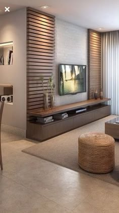 a living room filled with furniture and a flat screen tv on top of a wall