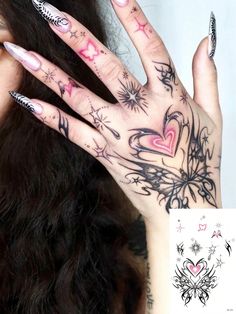 a woman's hand with tattoos on it and her hands behind her are shown