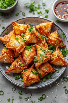 A plate of golden, crispy wontons garnished with chopped green onions, with dipping sauce in the background. Beef Wellington Bites, Wonton Appetizers, Cream Cheese Wontons, New Air Fryer Recipes, Wonton Recipes, Fried Beef, Beef Wellington, Quick Easy Snacks, Air Fryer Healthy