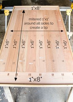 a wooden table with measurements on it