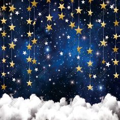 stars and clouds in the night sky with stars hanging from it's sides, as if