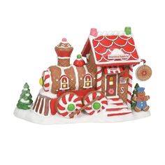 a large gingerbread house is decorated with candy canes