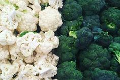 broccoli and cauliflower are stacked on top of each other