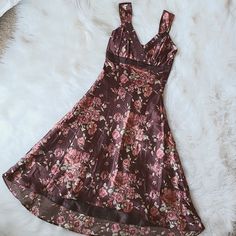 Beautiful Dress. This Has A Mix Of Maroon And Blush Pinks And Rose And Gold Colors. Brand New, Never Worn. Tag Size Xs.. Size 2. Sorry For The Wrinkles. This Does Have Elastic Around The Back. I Measured Without Stretching... Armpit To Armpit: 14" Waist: 13" Total Length: (Shortest In Front): 40" (Longest In Back): 47" Vintage Satin Summer Dresses, Vintage Satin V-neck Dress, Knee-length Satin Dress With Floral Print, Floral High Low Dress, Gown Style, Dream Outfits, Gold Colors, Empire Dress, Chiffon Maxi